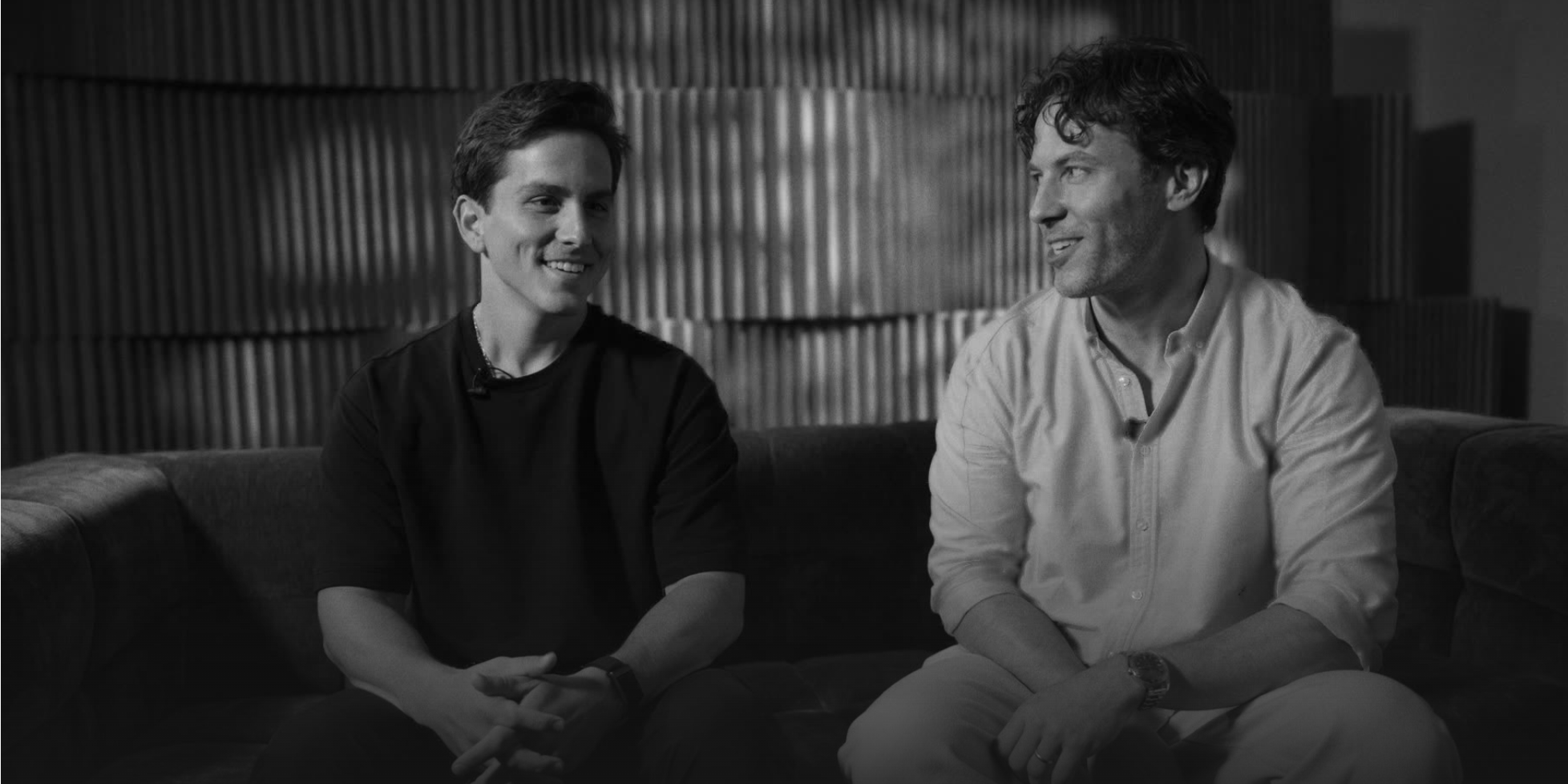 Two customers sharing their story in a filmed interview